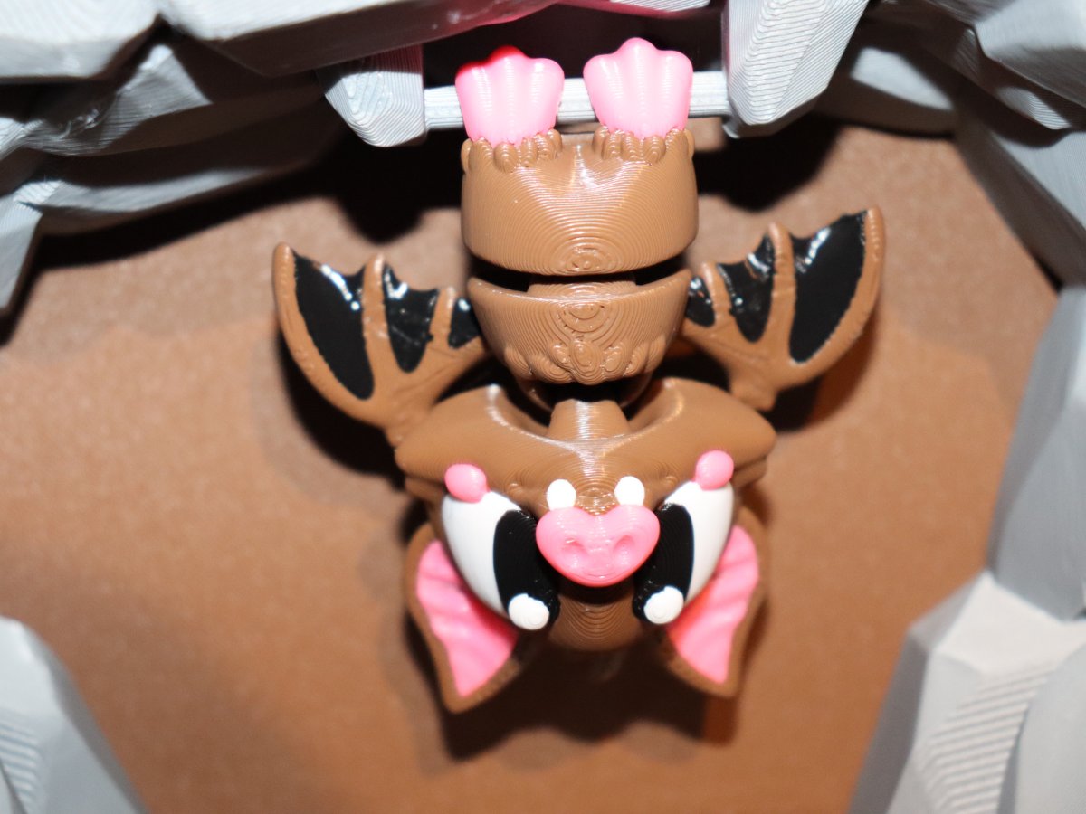 Hängende Fledermaus mit Ast